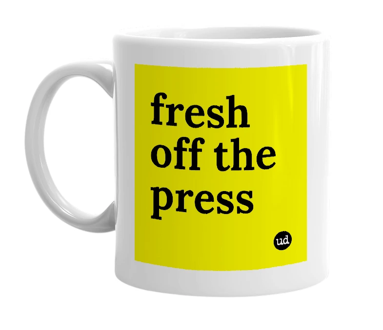 White mug with 'fresh off the press' in bold black letters