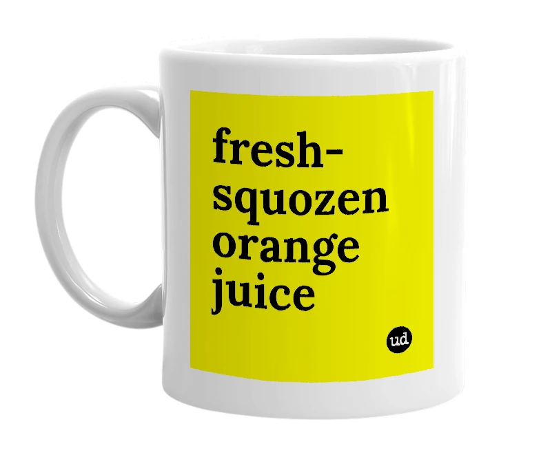 White mug with 'fresh-squozen orange juice' in bold black letters