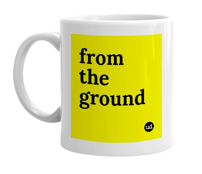 White mug with 'from the ground' in bold black letters