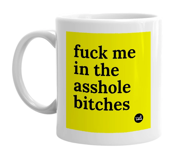 White mug with 'fuck me in the asshole bitches' in bold black letters