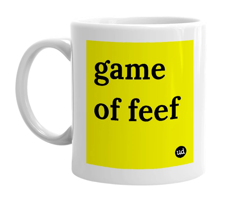 White mug with 'game of feef' in bold black letters