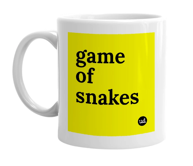 White mug with 'game of snakes' in bold black letters