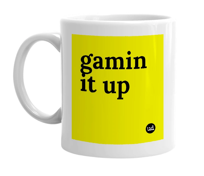 White mug with 'gamin it up' in bold black letters