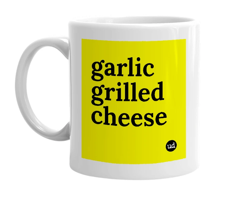 White mug with 'garlic grilled cheese' in bold black letters