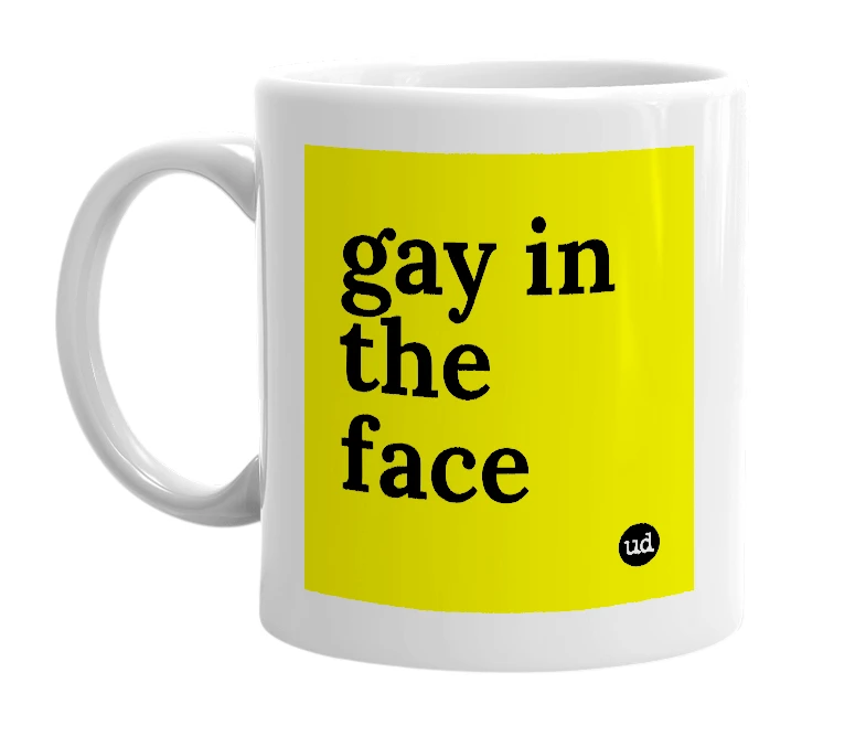 White mug with 'gay in the face' in bold black letters