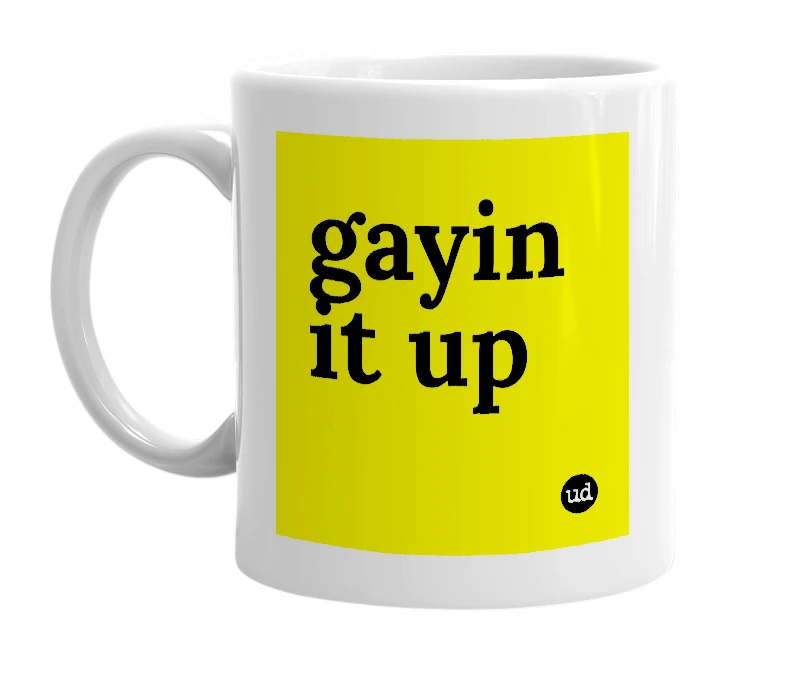 White mug with 'gayin it up' in bold black letters
