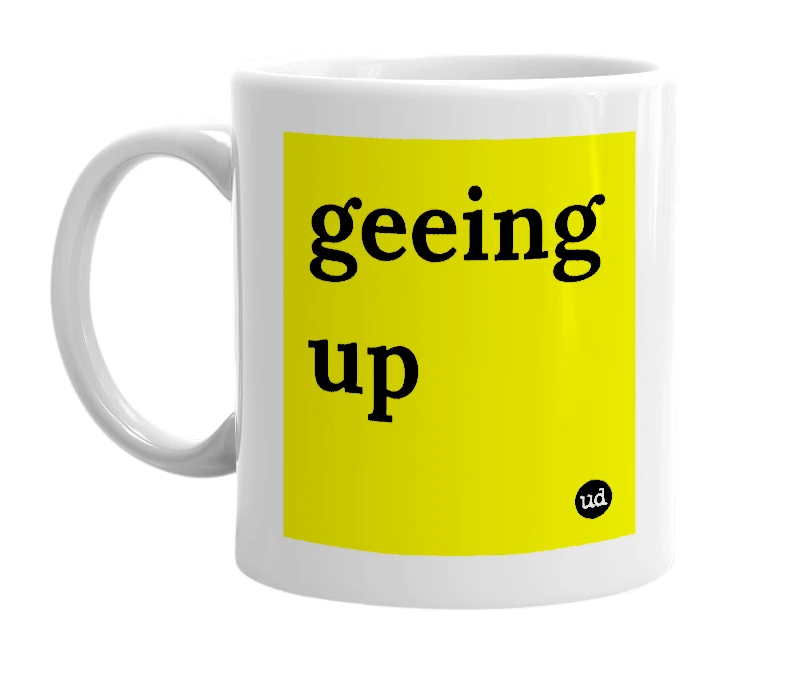 White mug with 'geeing up' in bold black letters