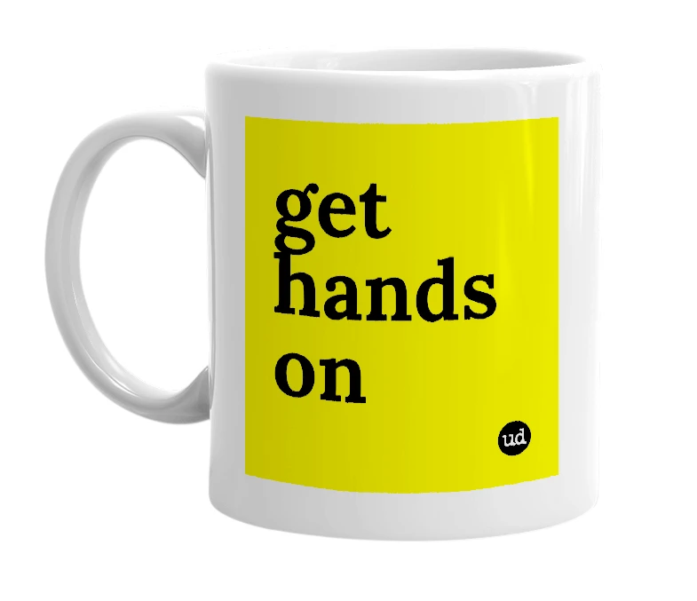 White mug with 'get hands on' in bold black letters