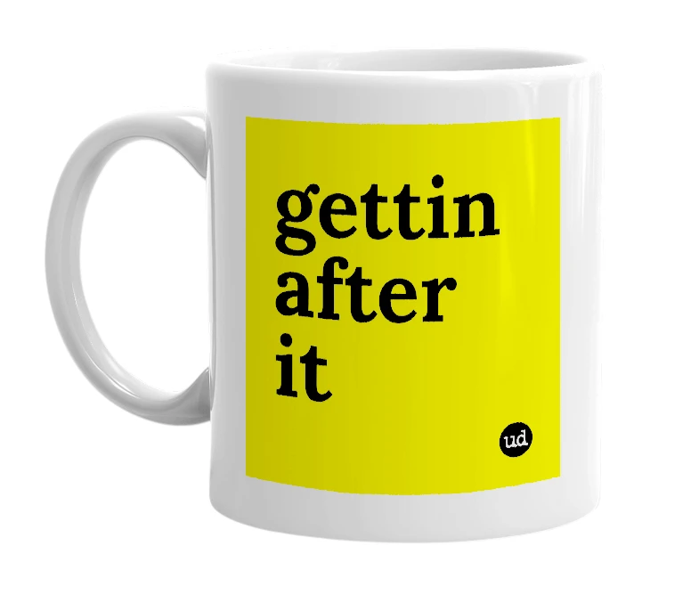 White mug with 'gettin after it' in bold black letters