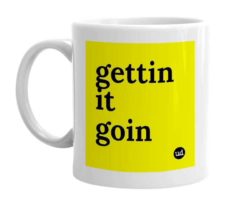 White mug with 'gettin it goin' in bold black letters