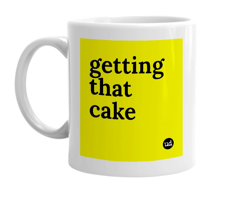 White mug with 'getting that cake' in bold black letters