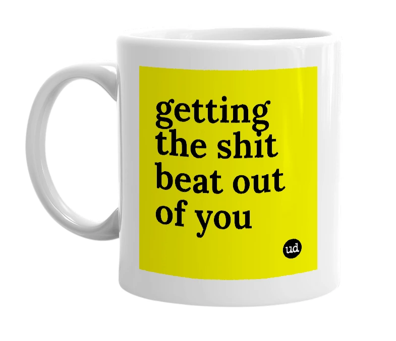 White mug with 'getting the shit beat out of you' in bold black letters