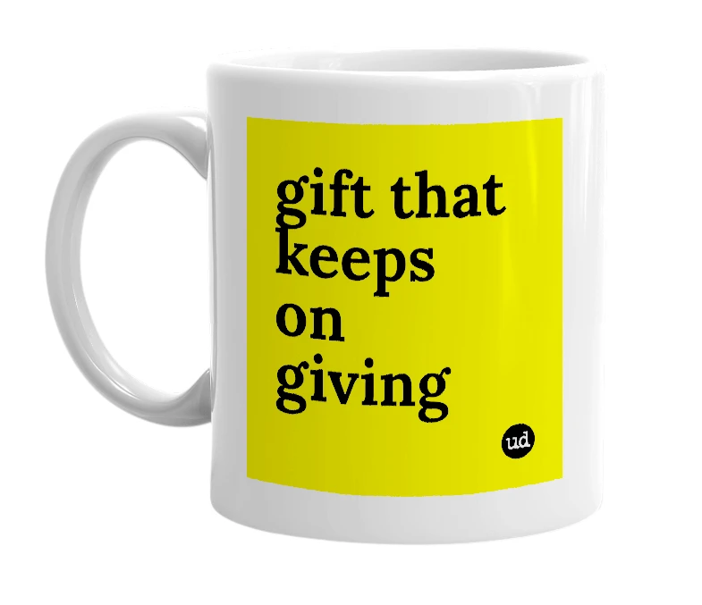 White mug with 'gift that keeps on giving' in bold black letters