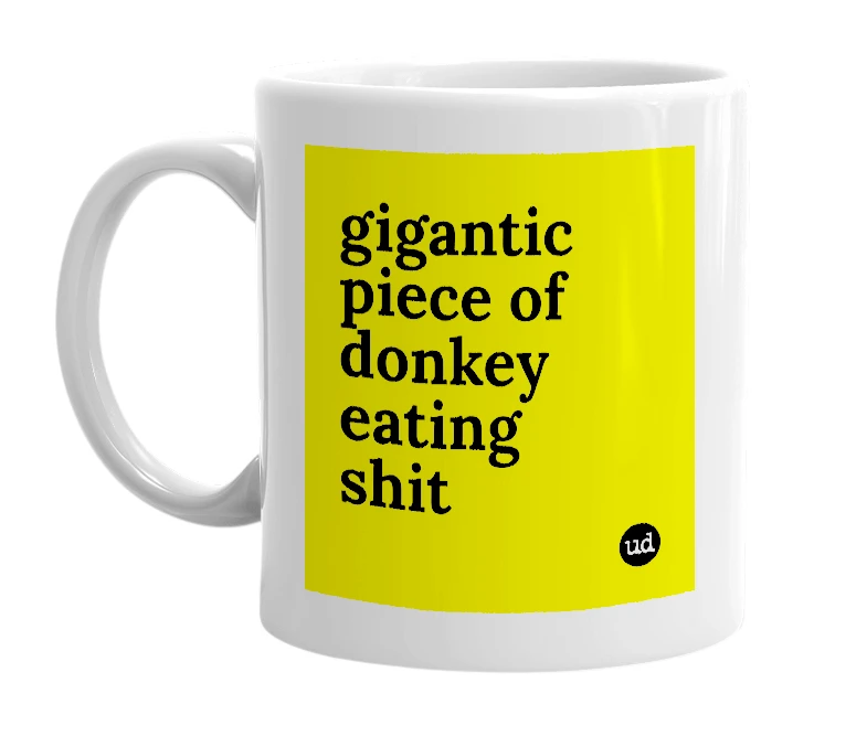 White mug with 'gigantic piece of donkey eating shit' in bold black letters