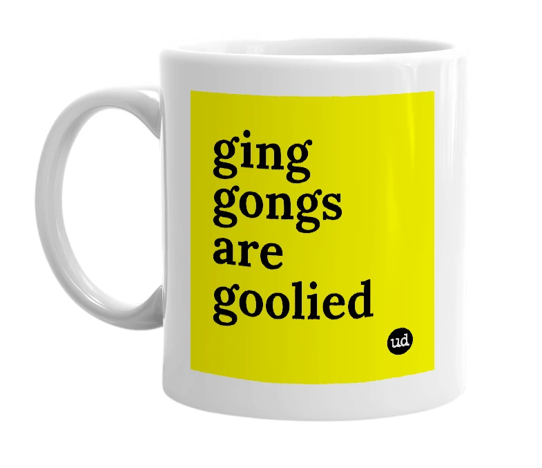 White mug with 'ging gongs are goolied' in bold black letters