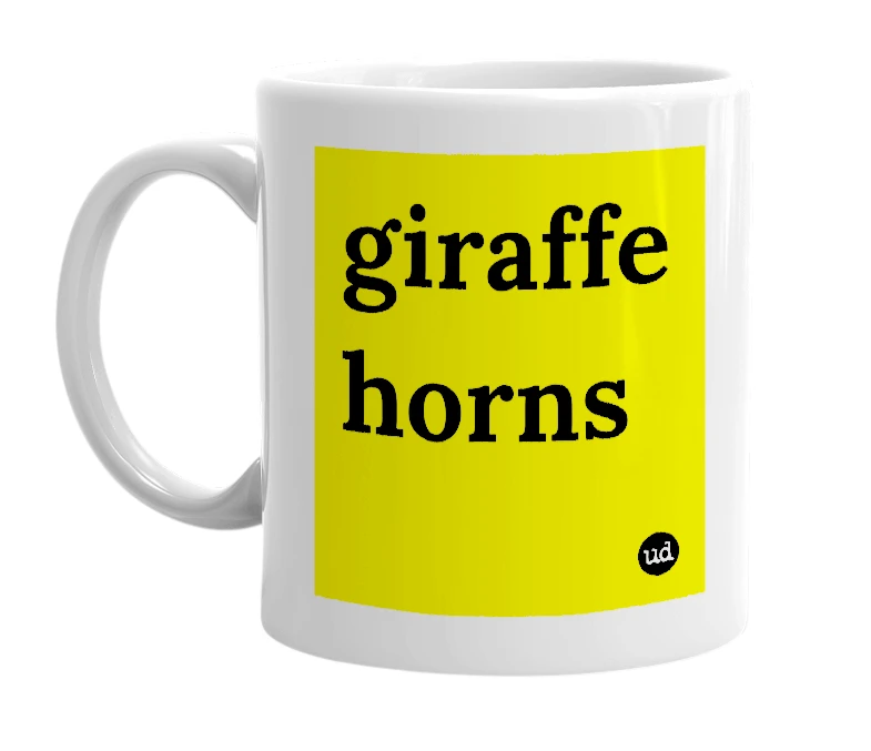 White mug with 'giraffe horns' in bold black letters