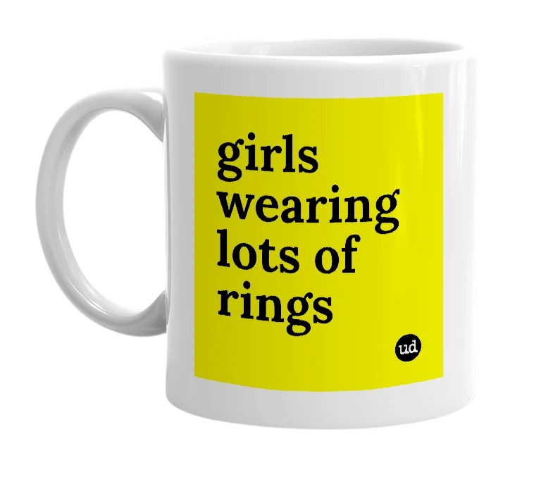 White mug with 'girls wearing lots of rings' in bold black letters