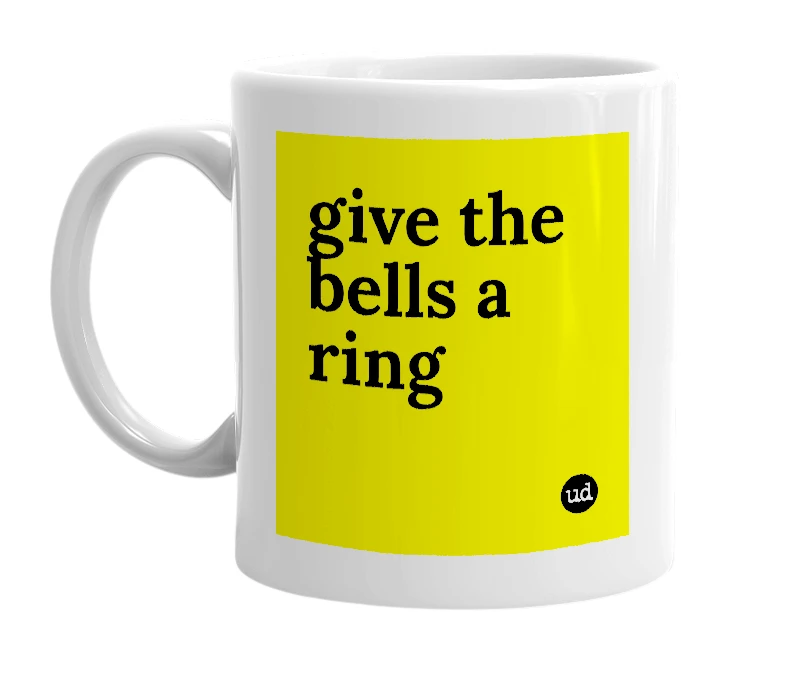 White mug with 'give the bells a ring' in bold black letters