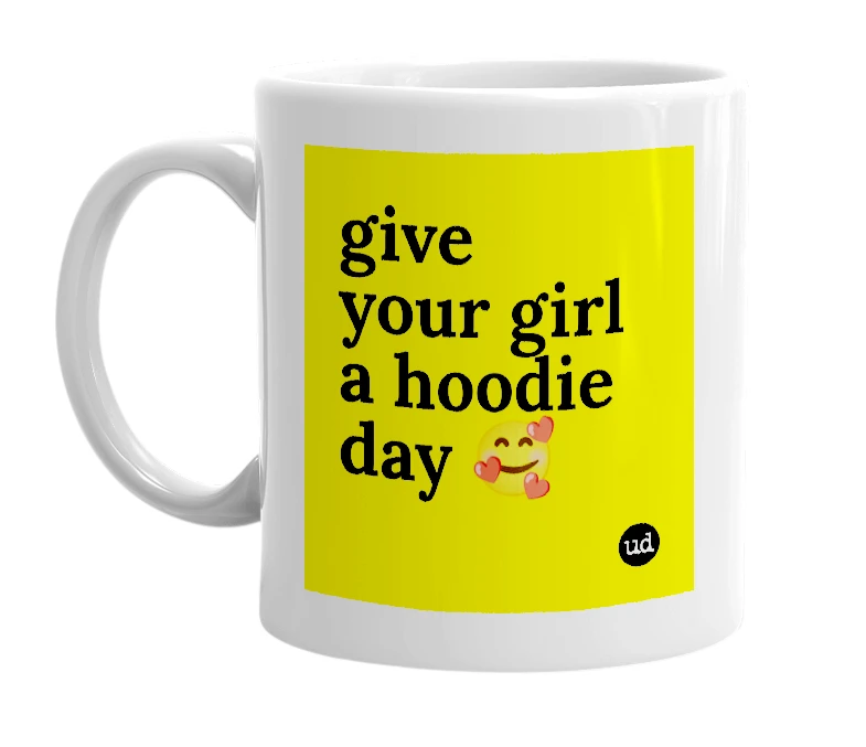 White mug with 'give your girl a hoodie day 🥰' in bold black letters