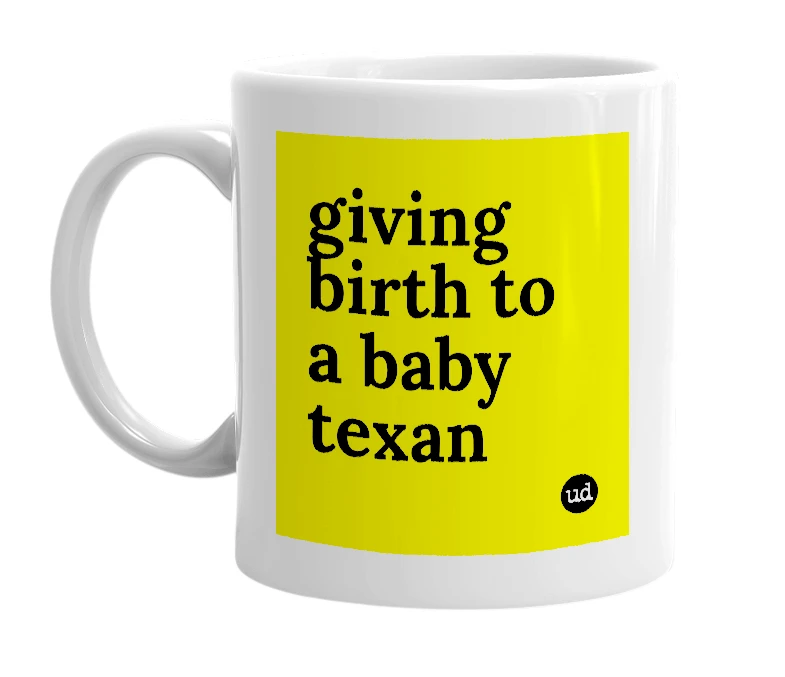 White mug with 'giving birth to a baby texan' in bold black letters