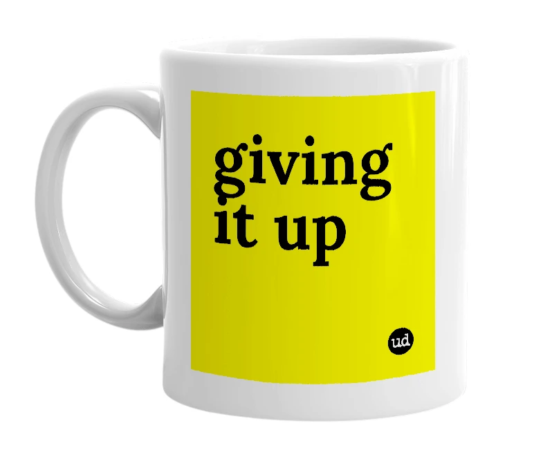 White mug with 'giving it up' in bold black letters