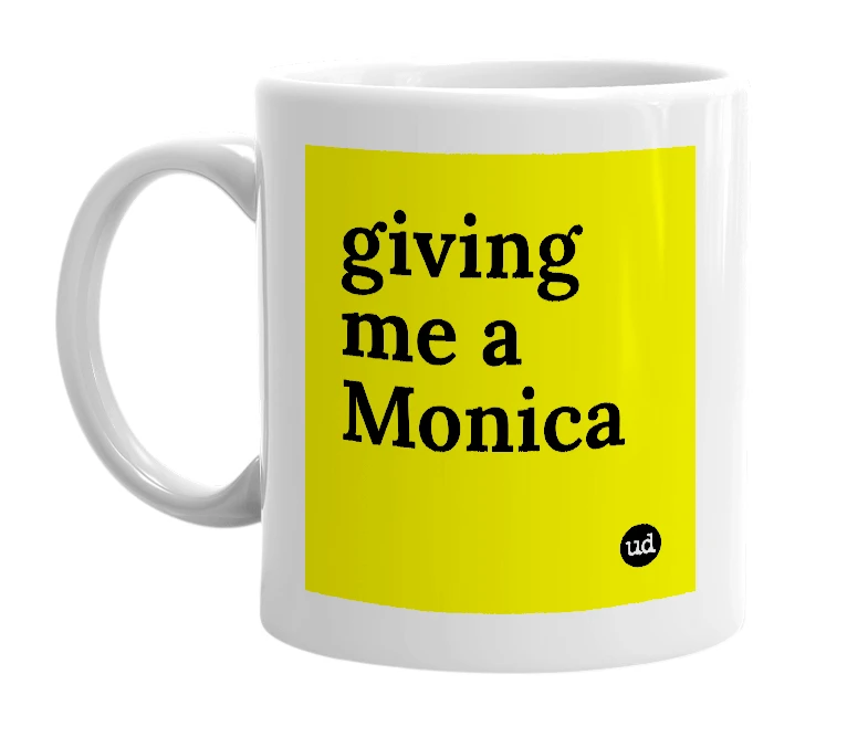 White mug with 'giving me a Monica' in bold black letters