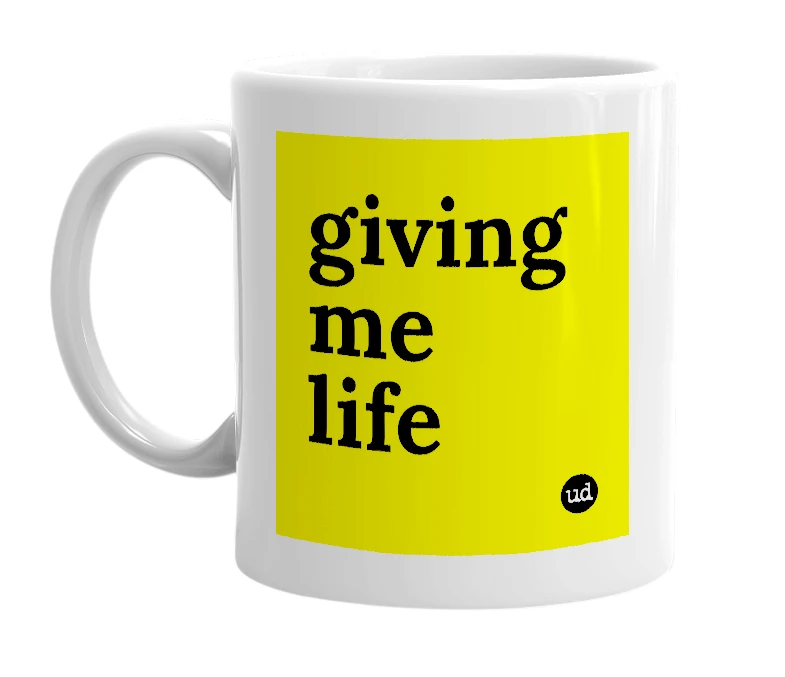 White mug with 'giving me life' in bold black letters