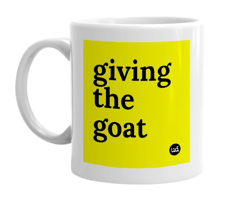 White mug with 'giving the goat' in bold black letters