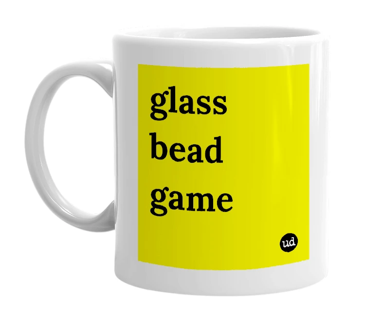 White mug with 'glass bead game' in bold black letters