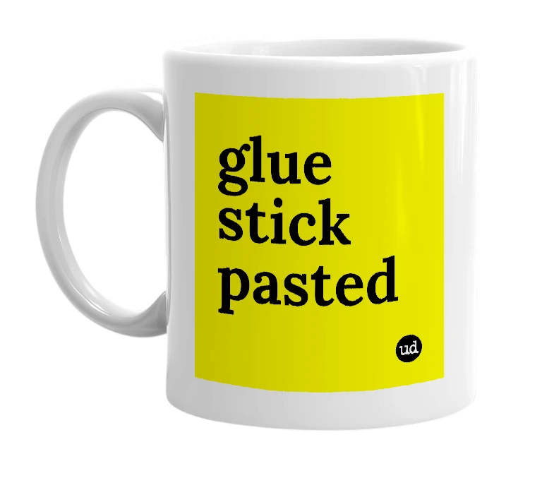 White mug with 'glue stick pasted' in bold black letters