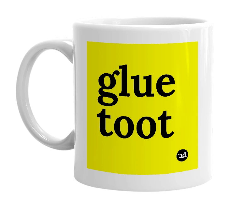White mug with 'glue toot' in bold black letters