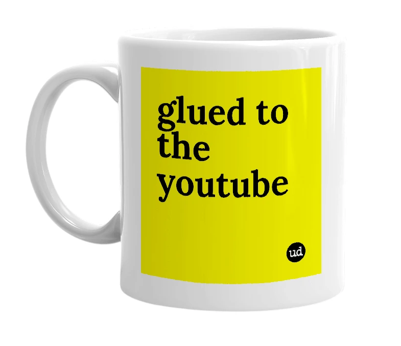 White mug with 'glued to the youtube' in bold black letters