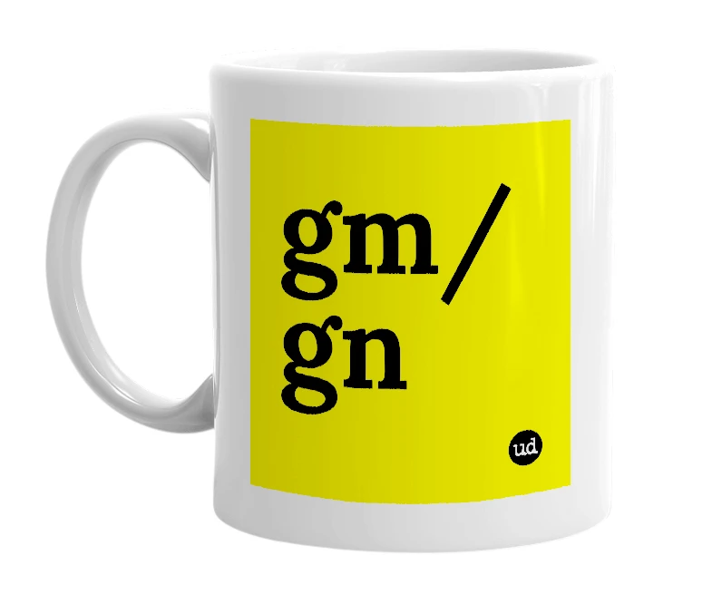 White mug with 'gm/gn' in bold black letters