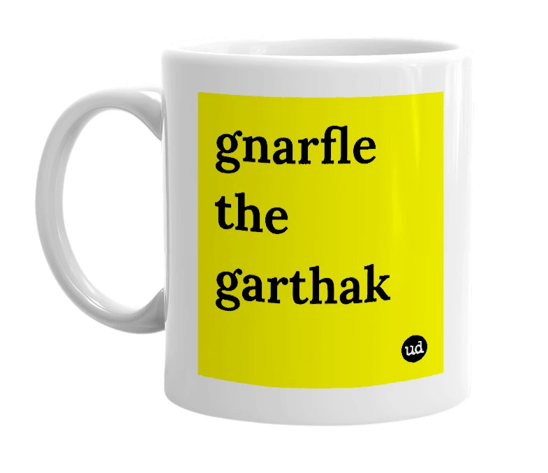 White mug with 'gnarfle the garthak' in bold black letters