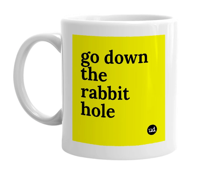 White mug with 'go down the rabbit hole' in bold black letters