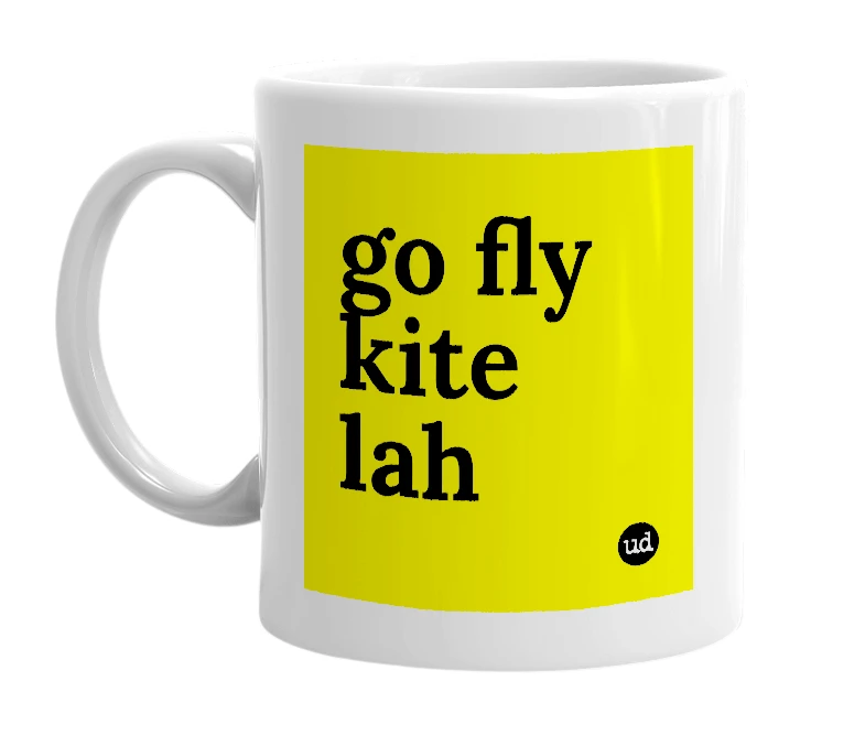 White mug with 'go fly kite lah' in bold black letters