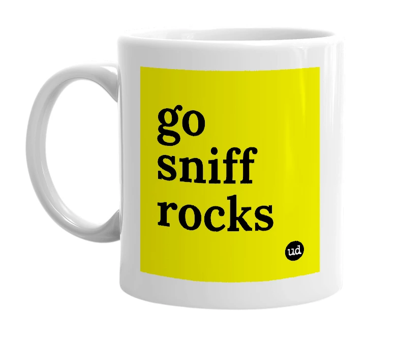 White mug with 'go sniff rocks' in bold black letters