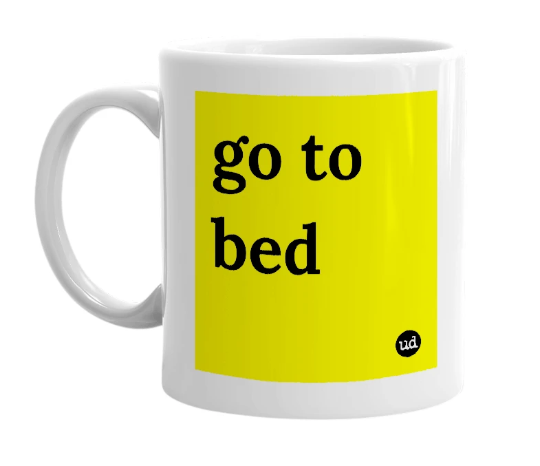 White mug with 'go to bed' in bold black letters