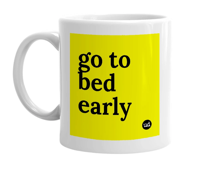 White mug with 'go to bed early' in bold black letters