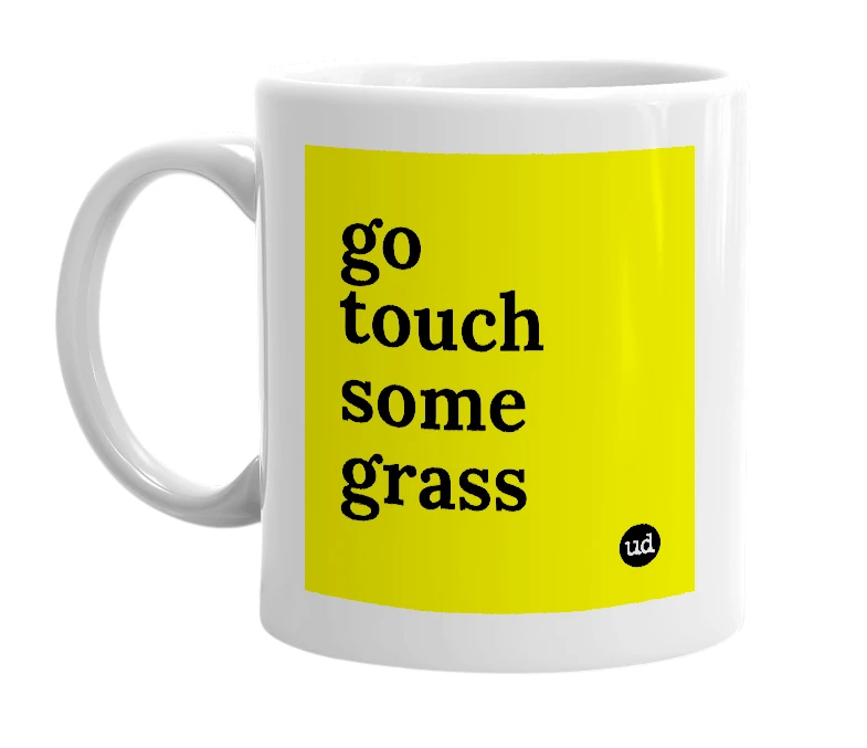 White mug with 'go touch some grass' in bold black letters