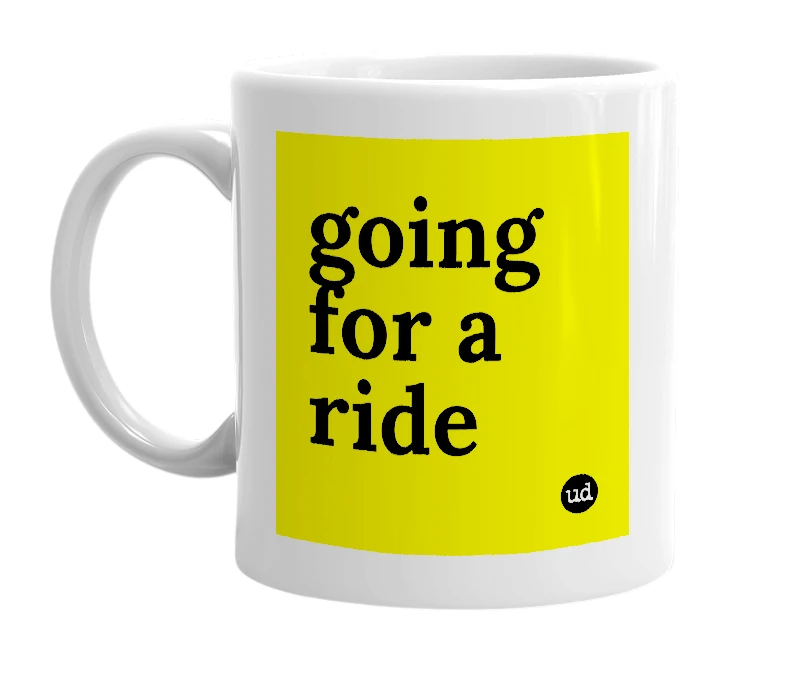 White mug with 'going for a ride' in bold black letters