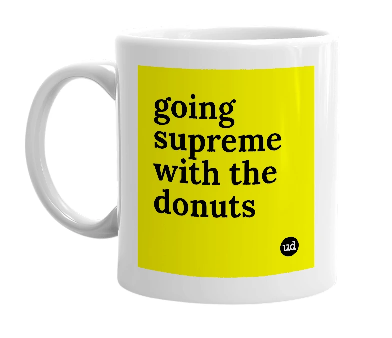 White mug with 'going supreme with the donuts' in bold black letters