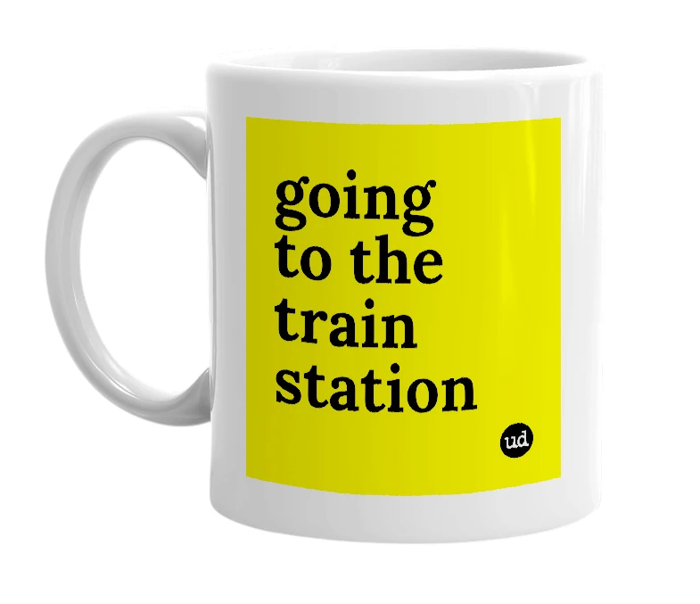 White mug with 'going to the train station' in bold black letters