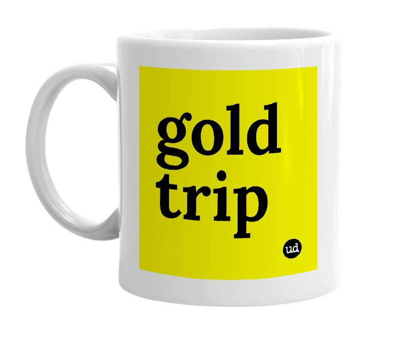 White mug with 'gold trip' in bold black letters