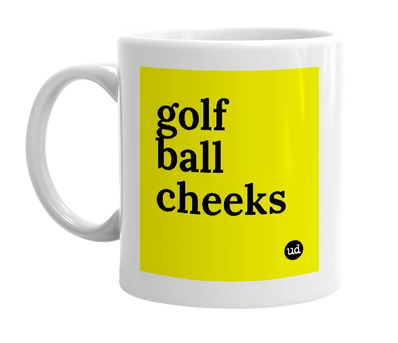 White mug with 'golf ball cheeks' in bold black letters
