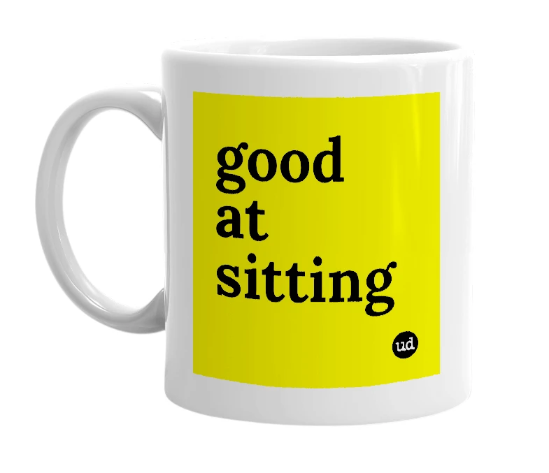 White mug with 'good at sitting' in bold black letters