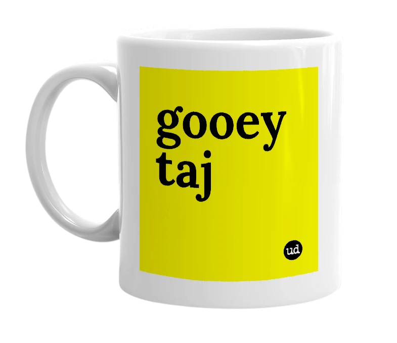 White mug with 'gooey taj' in bold black letters