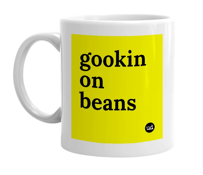 White mug with 'gookin on beans' in bold black letters