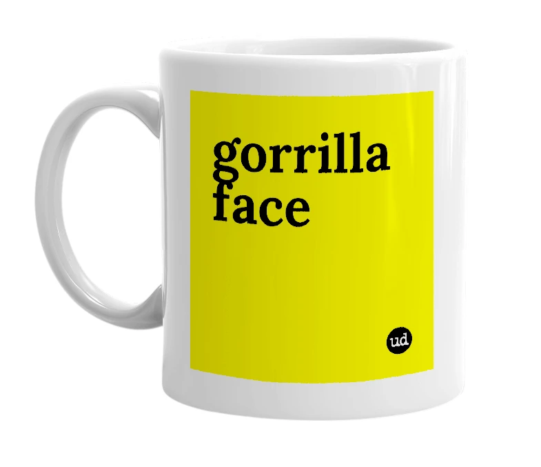 White mug with 'gorrilla face' in bold black letters