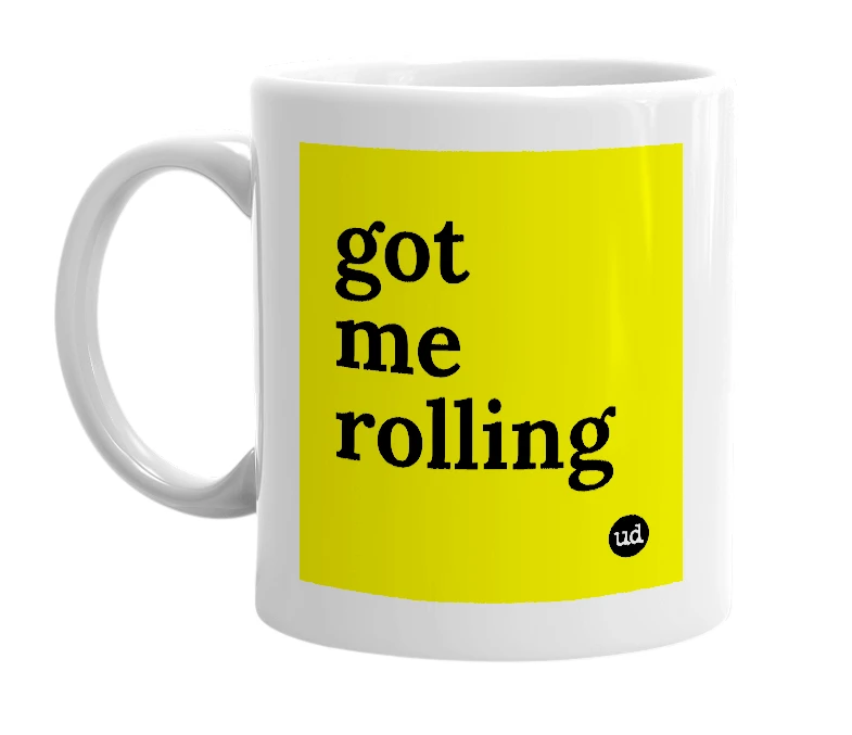 White mug with 'got me rolling' in bold black letters